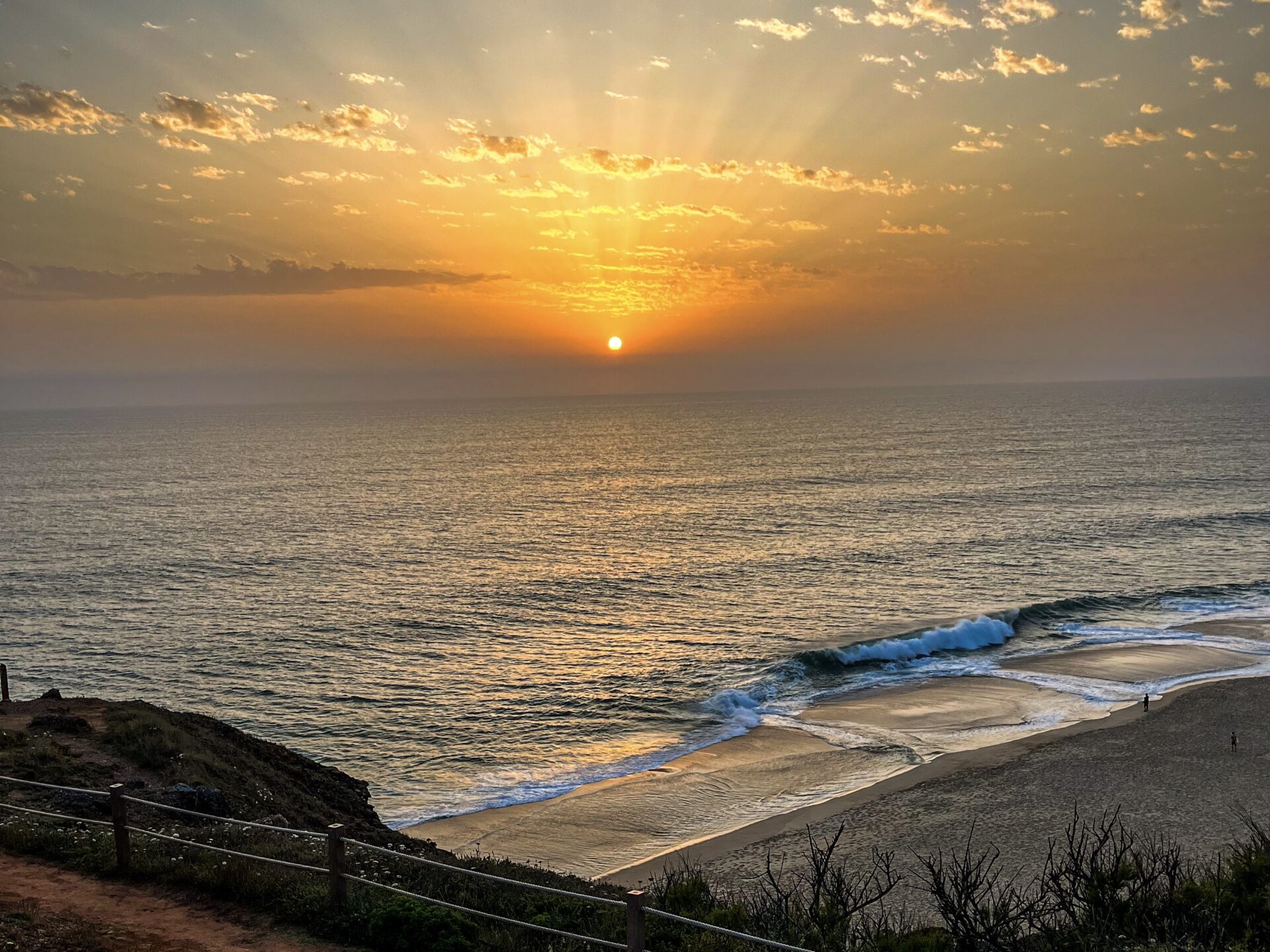 Saudade: The Feeling I Carried Home from Portugal 9 IMG 8696 Sunset view from the cliffs at Praia do Norte in Nazaré.