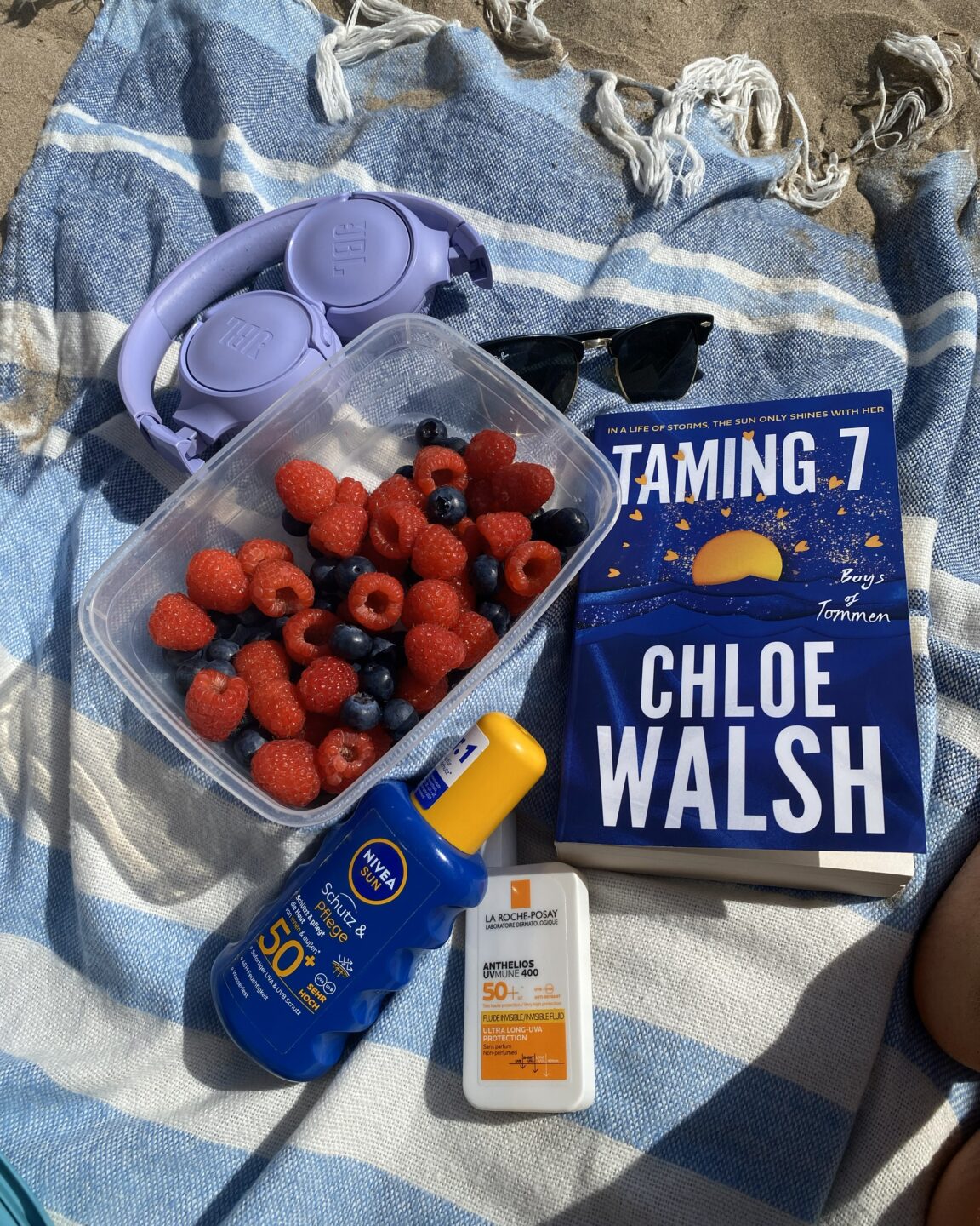 Caught in Between: How I became Part of a Conflict that was never mine 15 blog3 My typical beach gear, including a book, sunscreen, sunglasses, fruit, and headphones.