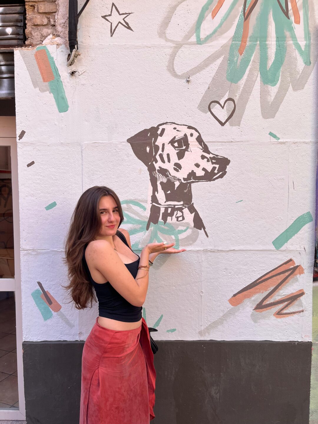 Posing with street art in Valencia.